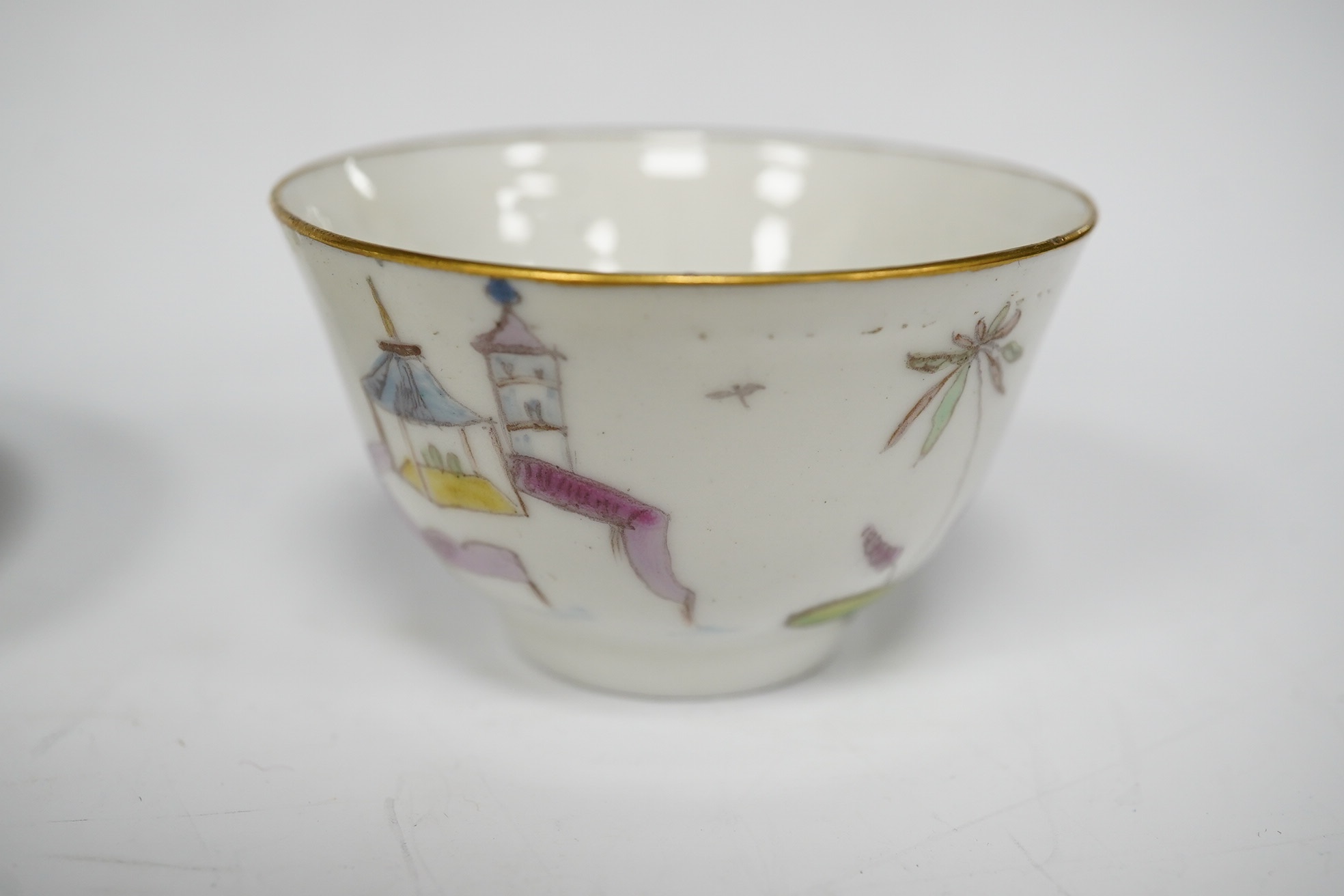 A Nove porcelain tea bowl and saucer, c.1770-75, hand painted with Chinese figures, iron red asterisk marks, 11.5cm in diameter